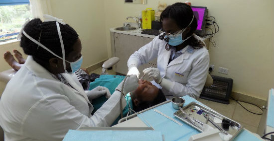 dentists working with patient