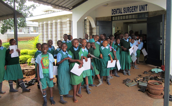 children lined up outside dental surgery unit